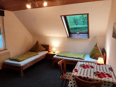Ein Bett oder Betten in einem Zimmer der Unterkunft Gästezimmer Löhrbacher Tal