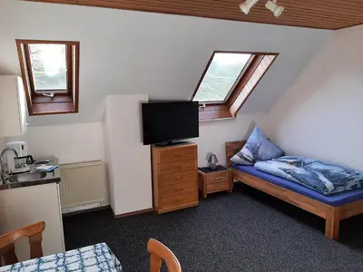 Ein Bett oder Betten in einem Zimmer der Unterkunft Gästezimmer Löhrbacher Tal