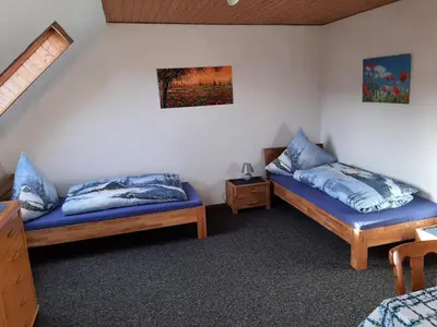 Ein Bett oder Betten in einem Zimmer der Unterkunft Gästezimmer Löhrbacher Tal