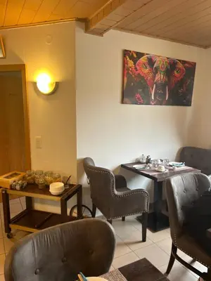 Ein Sitzbereich in der Unterkunft Pension Zum Paradies