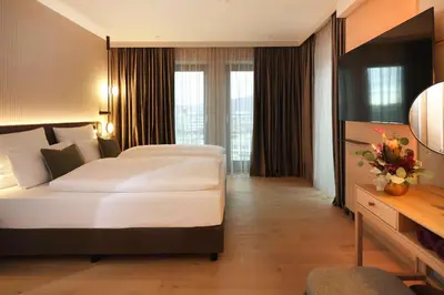 Ein Bett oder Betten in einem Zimmer der Unterkunft ATLANTIC Hotel Heidelberg
