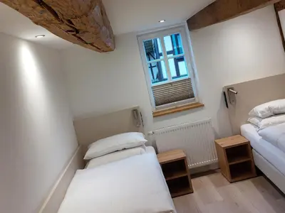 Ein Bett oder Betten in einem Zimmer der Unterkunft Gasthaus zum Ochsen