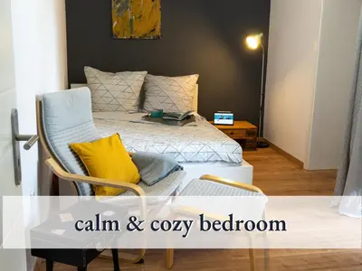 Ein Bett oder Betten in einem Zimmer der Unterkunft Parterre Lounge mit Terrasse -Nähe Karlsruhe & KIT - ohne Treppen -barrierefreie Dusche