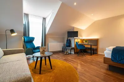 Ein Sitzbereich in der Unterkunft Weingut Schreieck VINOTEL & GUTSHAUS