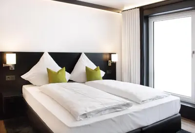 Ein Bett oder Betten in einem Zimmer der Unterkunft RNK Hotel by WMM Hotels