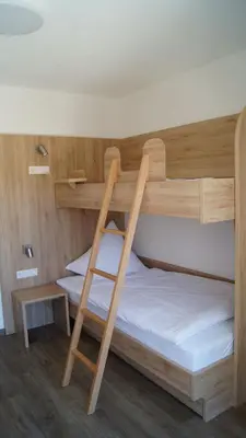 Ein Bett oder Betten in einem Zimmer der Unterkunft Gästehaus Winzerhof am Schlierbach