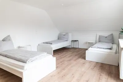 Ein Bett oder Betten in einem Zimmer der Unterkunft Eindrucksvolles Gruppen– und Monteursloft