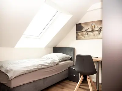 Ein Bett oder Betten in einem Zimmer der Unterkunft Pension HSL