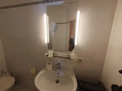 Ein Badezimmer in der Unterkunft App 21 Gästehaus Zwingenberg