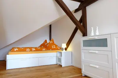 Ein Bett oder Betten in einem Zimmer der Unterkunft heidel-home 2Raum Studio