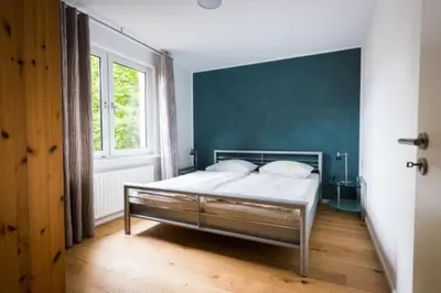 Ein Bett oder Betten in einem Zimmer der Unterkunft GASTHAUS Porzelt Wohnung 3