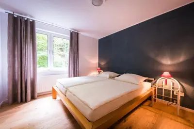 Ein Bett oder Betten in einem Zimmer der Unterkunft GASTHAUS Porzelt Wohnung 3