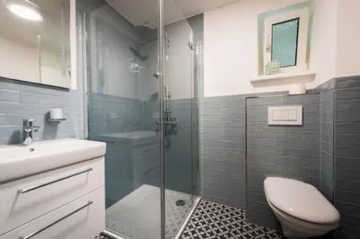 Ein Badezimmer in der Unterkunft GASTHAUS Porzelt Wohnung 3