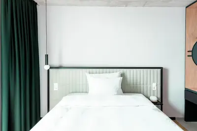 Ein Bett oder Betten in einem Zimmer der Unterkunft Coreum Hotel