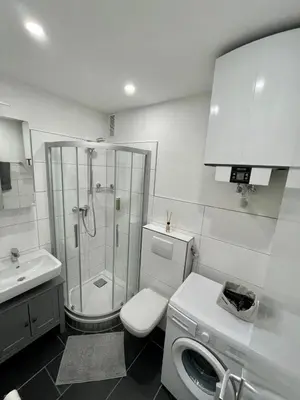 Ein Badezimmer in der Unterkunft Urbanes Apartment Nähe ECE - Center & Schloss