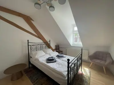 Ein Bett oder Betten in einem Zimmer der Unterkunft Haardter Mandelring