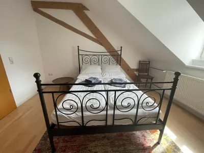 Ein Bett oder Betten in einem Zimmer der Unterkunft Haardter Mandelring