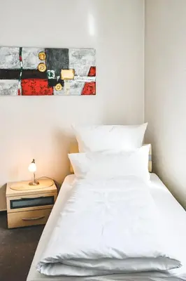 Ein Bett oder Betten in einem Zimmer der Unterkunft Land.Wein.Gut Pension