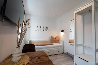 Ein Bett oder Betten in einem Zimmer der Unterkunft Altstadt Apartments