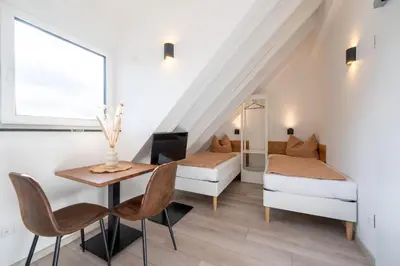 Ein Bett oder Betten in einem Zimmer der Unterkunft Altstadt Apartments