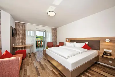 Ein Bett oder Betten in einem Zimmer der Unterkunft Wo der Hahn kräht