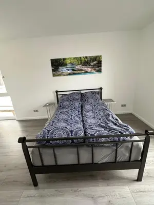 Ein Bett oder Betten in einem Zimmer der Unterkunft Deluxe Appartement