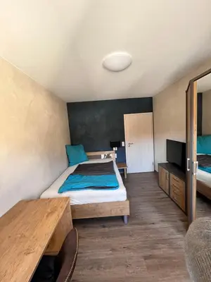 Ein Bett oder Betten in einem Zimmer der Unterkunft Gasthof Seeklause