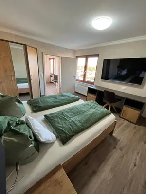 Ein Bett oder Betten in einem Zimmer der Unterkunft Gasthof Seeklause