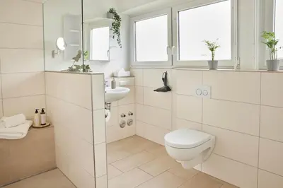 Ein Badezimmer in der Unterkunft Ajko Homes - Design Apartment - Parkplatz - Balkon - Netflix - 6 Pers