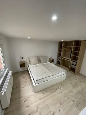 Ein Bett oder Betten in einem Zimmer der Unterkunft Casa Bergstraße 2