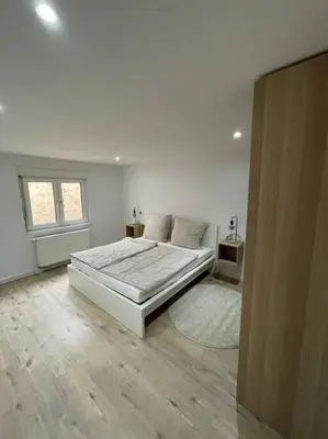Ein Bett oder Betten in einem Zimmer der Unterkunft Casa Bergstraße 2