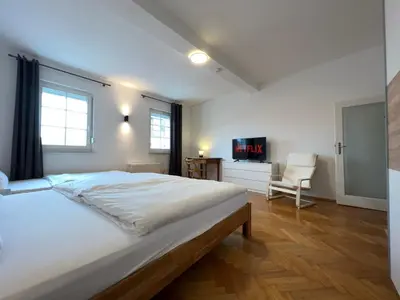 Ein Bett oder Betten in einem Zimmer der Unterkunft Große Maisonette-Wohnung by Rabe - Gartenabteil, Smart-TV, Netflix