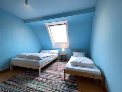 Ein Bett oder Betten in einem Zimmer der Unterkunft Große Maisonette-Wohnung by Rabe - Gartenabteil, Smart-TV, Netflix