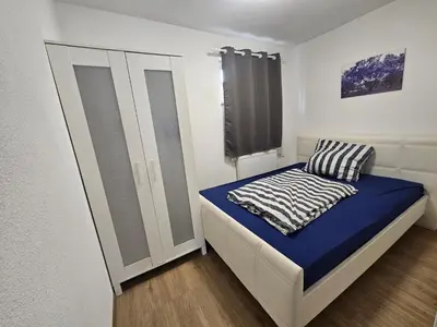 Ein Bett oder Betten in einem Zimmer der Unterkunft Gemütliche Wohnung in Happenbach