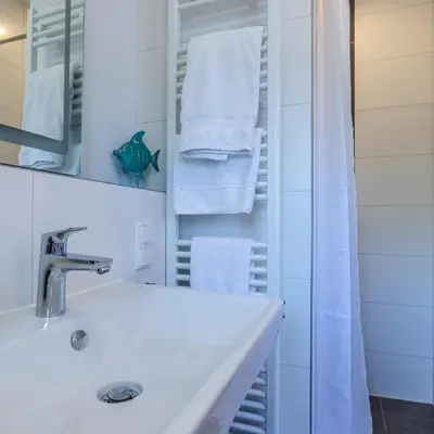 Ein Badezimmer in der Unterkunft IMMOCITY Apartments