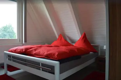Ein Bett oder Betten in einem Zimmer der Unterkunft Ferienhaus in Waldkatzenbach modern & renoviert