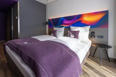 Ein Bett oder Betten in einem Zimmer der Unterkunft Holiday Inn-the niu, Wave Karlsruhe Oststadt by IHG