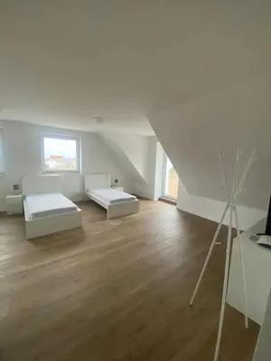 Ein Bett oder Betten in einem Zimmer der Unterkunft Monteurwohnungen im Weedenhof 55270 Zornheim