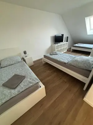 Ein Bett oder Betten in einem Zimmer der Unterkunft Monteurwohnungen im Weedenhof 55270 Zornheim